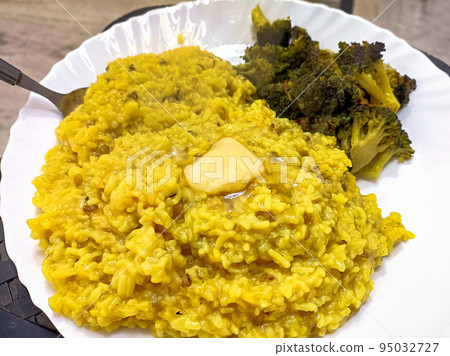Dal khichdi or Khichadi with broccoli curry Tasty Indian recipe served in plate Dal khichdi or Khichadi with broccoli curry Tasty Indian recipe served in plate 95032727