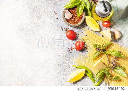 Cooking traditional italian pasta. Ingredients on a stone tabletop. Italian food background. View from above. Copy space. 95033492