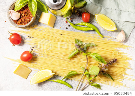 Cooking traditional italian pasta. Ingredients on a stone tabletop. Italian food background. View from above. Cooking traditional italian pasta. Ingredients on a stone tabletop. Italian food background. View from above. 95033494