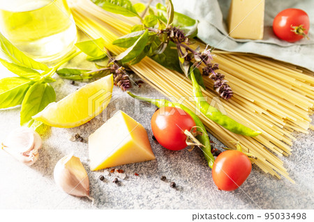 Italian food background. Cooking traditional italian pasta. Ingredients on a stone tabletop. 95033498