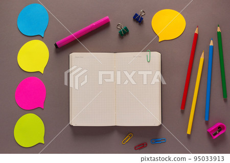Open notepad and school stationary supplies on paper table. Back to school concept idea Open notepad and school stationary supplies on paper table. Back to school concept idea 95033913