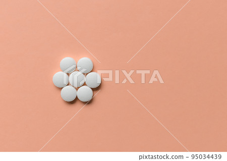 Pills on pink background, supplement, medicine concept. Closeup, copy space 95034439