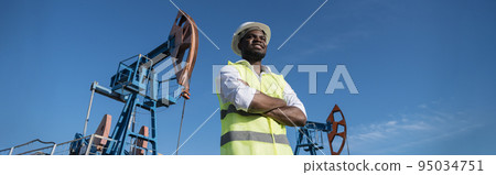 African American developer explores location of pump jacks African American developer explores location of pump jacks 95034751