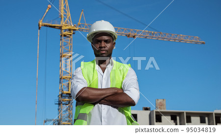 African American man builder looks with serious expression African American man builder looks with serious expression 95034819