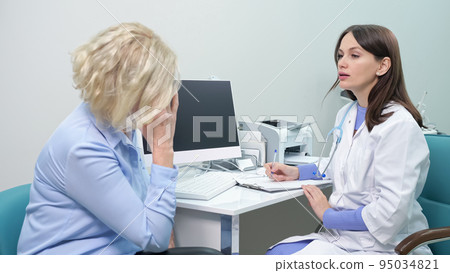 Woman complains of migraine and neck pain before scanning 95034821