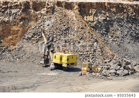 Old machinery work in a basalt quarry 95035643