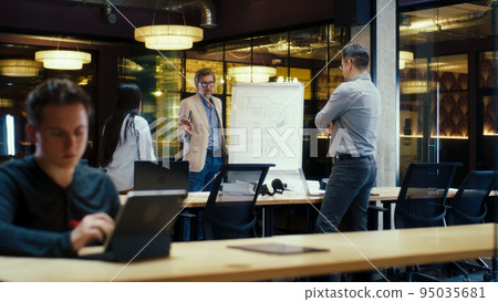 Group of office workers having meeting Group of office workers having meeting 95035681