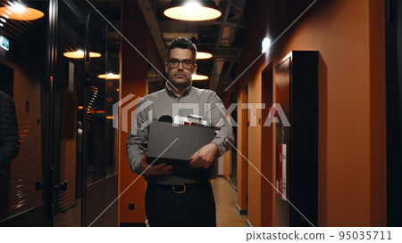 Fired man saying goodbye to colleagues Fired man saying goodbye to colleagues 95035711