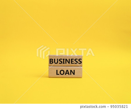 Business loan symbol. Concept words business loan on wooden blocks. Beautiful yellow background. Business and business loan concept. Copy space. Business loan symbol. Concept words business loan on wooden blocks. Beautiful yellow background. Business and business loan concept. Copy space. 95035821