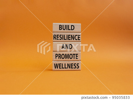 Build Resilience and Promote Wellness symbol. Wooden blocks with words Build Resilience and Promote Wellness. Beautiful orange background. Build Resilience and Promote Wellness. Copy space Build Resilience and Promote Wellness symbol. Wooden blocks with words Build Resilience and Promote Wellness. Beautiful orange background. Build Resilience and Promote Wellness. Copy space 95035833