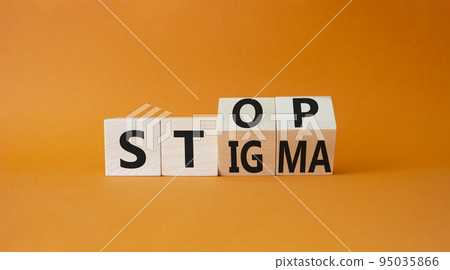 Stop and Stigma symbol. Businessman hand points at wooden cubes with words Stop and Stigma. Beautiful orange background. Business and Stop and Stigma concept. Copy space. Stop and Stigma symbol. Businessman hand points at wooden cubes with words Stop and Stigma. Beautiful orange background. Business and Stop and Stigma concept. Copy space. 95035866