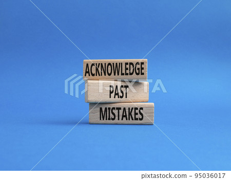 Acknowledge Past Mistakes symbol. Wooden blocks with words Acknowledge Past Mistakes. Beautiful blue background. Business and Acknowledge Past Mistakes. Copy space. 95036017
