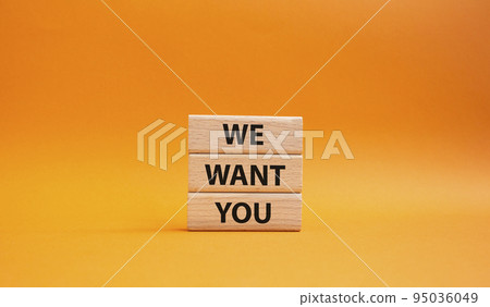 We want you symbol. Concept words We want you on wooden blocks. Beautiful orange background. Business and We want you concept. Copy space. 95036049