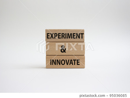 Experiment and innovate symbol. Concept words Experiment and innovate on wooden blocks. Beautiful white background. Business and Experiment and innovate concept. Copy space. 95036085