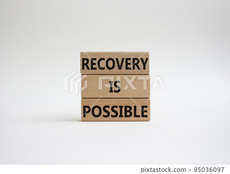 Recovery is possible symbol. Concept words Recovery is possible on wooden blocks. Beautiful white background. Business and Recovery is possible concept. Copy space. 95036097