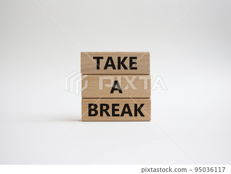 Take a break symbol. Concept words 'Take a break' on wooden blocks. Beautiful white background. Business and Take a break concept. Copy space. Take a break symbol. Concept words 'Take a break' on wooden blocks. Beautiful white background. Business and Take a break concept. Copy space. 95036117