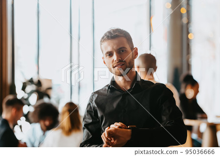 Cheerful self confident professional businessman with crossed hands portrait. 95036666
