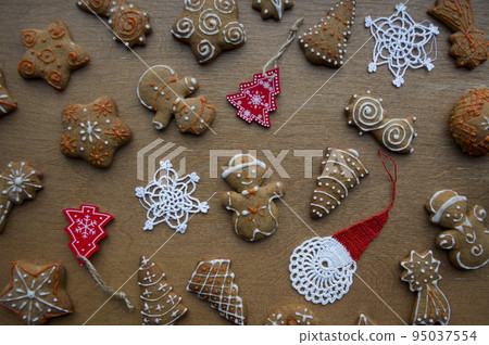 Set of different homemade Christmas cookies isolated on background, close up view with copy space for text. New year frame with tasty gingerbread cookies with spices. Winter holiday concept 95037554