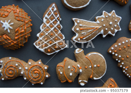 Set of different homemade Christmas cookies isolated on background, close up view with copy space for text. New year frame with tasty gingerbread cookies with spices. Winter holiday concept Set of different homemade Christmas cookies isolated on background, close up view with copy space for text. New year frame with tasty gingerbread cookies with spices. Winter holiday concept 95037579