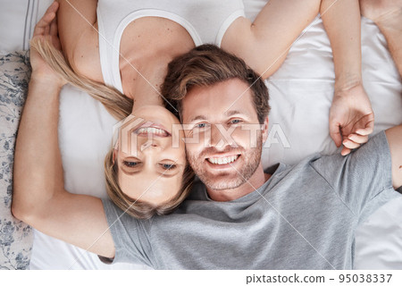 Couple portrait, above bed and smile for love marriage in bedroom, happy with support and content with sleep. Top view face of calm man and woman in happiness together after sleeping in apartment Couple portrait, above bed and smile for love marriage in bedroom, happy with support and content with sleep. Top view face of calm man and woman in happiness together after sleeping in apartment 95038337