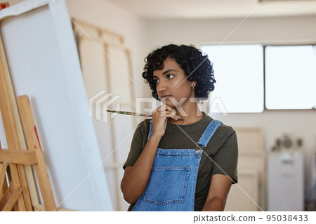 Paint, art and idea with a woman thinking about an artistic project in her design studio for creative expression. Painter, artistic and creativity with a painter doubt or confused in a workshop Paint, art and idea with a woman thinking about an artistic project in her design studio for creative expression. Painter, artistic and creativity with a painter doubt or confused in a workshop 95038433