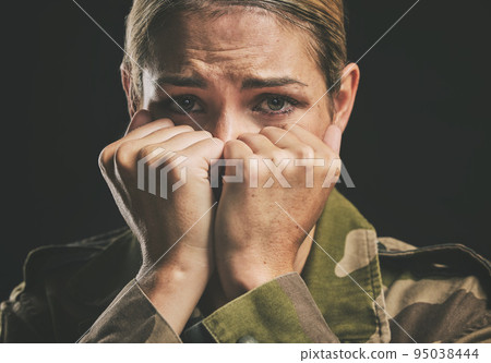 Army, trauma and mental health struggle of a woman veteran from war and soldier work. Portrait of a military worker and hero crying with anxiety, stress fear and ptsd feeling emotional with tears 95038444