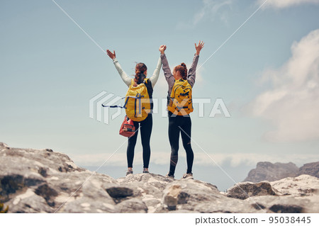 Hiking success, mountains travel and friends in celebration of fitness adventure, freedom in nature and cardio exercise on mountain in Switzerland. Women celebration of climbing cliff on holiday 95038445