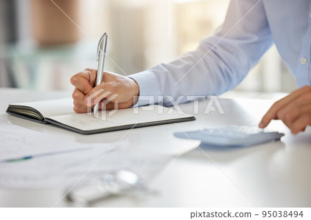 Accountant, notebook and audit budget with calculator while analyzing paperwork and doing finance planning in home. Hands of businessman writing doing tax and accounting report in book on a table Accountant, notebook and audit budget with calculator while analyzing paperwork and doing finance planning in home. Hands of businessman writing doing tax and accounting report in book on a table 95038494