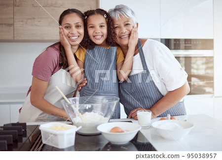 Baking, cooking or girl bonding with family in kitchen for breakfast food or learning sweet dessert recipe in home. Brazilian mother, grandmother and women in hug with happy child for house portrait 95038957