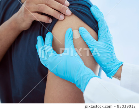 Band aid, hands and vaccine injection for covid, flu or global virus in security, safety or wellness insurance hospital. Zoom on doctor, medical employee or healthcare worker with arm plaster for man Band aid, hands and vaccine injection for covid, flu or global virus in security, safety or wellness insurance hospital. Zoom on doctor, medical employee or healthcare worker with arm plaster for man 95039012
