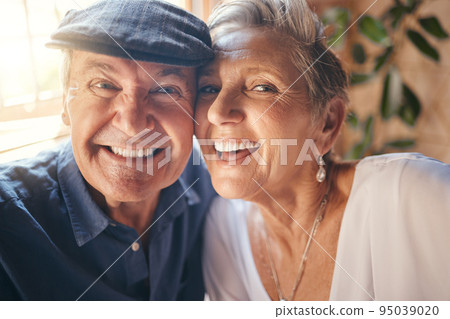 Face, selfie and senior couple bonding in restaurant, coffee shop or cafe for love marriage anniversary, celebration event or retirement. Zoom, man and mature woman in pov photograph with comic smile 95039020