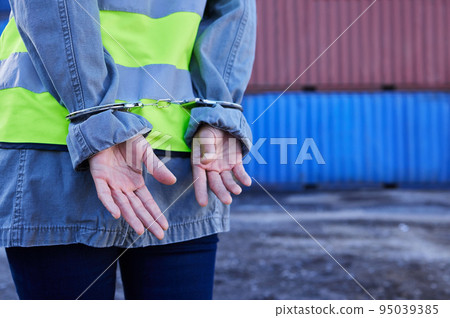 Corruption, crime and cargo engineer in handcuffs for fraud, money laundering business or supply chain scam. Construction worker, security guard or freight criminal arrest for legal job compliance Corruption, crime and cargo engineer in handcuffs for fraud, money laundering business or supply chain scam. Construction worker, security guard or freight criminal arrest for legal job compliance 95039385