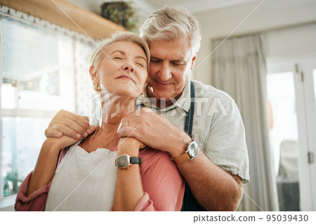 Senior couple, love and care relax in calm embrace for relationship together at home. Elderly man and woman relaxing in loving romance hugging for peaceful bonding moment at the house indoors Senior couple, love and care relax in calm embrace for relationship together at home. Elderly man and woman relaxing in loving romance hugging for peaceful bonding moment at the house indoors 95039430