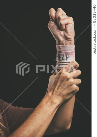 Help, suicide and injury for hand of man with depression, mental health problem or anxiety. Dark fear, self harm fail and sad mentally ill person with pain, wrist bandage and depressed over life 95039440