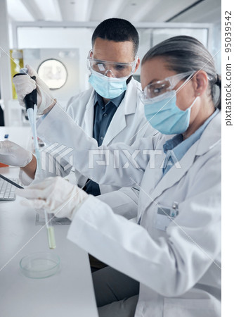 Covid, science and team of doctors working with vaccine research, medical or innovation analytics. Test tube, healthcare nurse or scientist with medicine, covid 19 or wellness in hospital lab 95039542