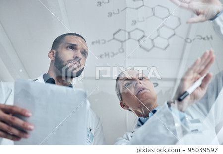 Scientist team, science and chemistry formula on glass board while solving or discuss experiment or solution in a medical laboratory. Innovation, discovery and development with biology man and woman 95039597