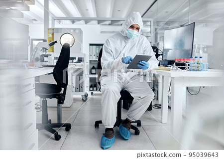 Covid, ppe and tablet with scientist in research laboratory for corona virus innovation, data management software and online results. Biotechnology expert digital analysis of healthcare medical test 95039643