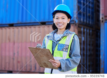 Logistics, cargo and a woman with inventory checklist on clipboard. Container yard, supply chain and happy shipping port employee from Japan. Smile, manager or inspector global freight company depot. Logistics, cargo and a woman with inventory checklist on clipboard. Container yard, supply chain and happy shipping port employee from Japan. Smile, manager or inspector global freight company depot. 95039748
