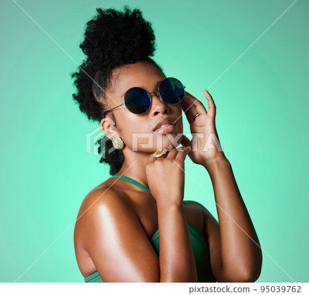 Fashion, beauty and retro black woman with sunglasses for vintage style, trend or eye protection. Face accessory, gen z and cool African girl or person with funky hairstyle, hipster shades and trendy 95039762