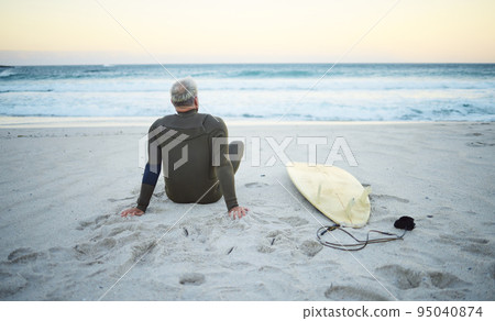 Beach, back view and old man surfer on holiday vacation in retirement relaxing and chill on ocean sand in Portugal. Surfing, senior and healthy person with surfboard watching waves at sea outdoors Beach, back view and old man surfer on holiday vacation in retirement relaxing and chill on ocean sand in Portugal. Surfing, senior and healthy person with surfboard watching waves at sea outdoors 95040874