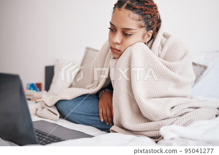 Depression, bed and woman streaming on a laptop, looking sad and lonely while searching for online comfort in bedroom. Mental health, anxiety and insomnia by bored black girl watching movie in home Depression, bed and woman streaming on a laptop, looking sad and lonely while searching for online comfort in bedroom. Mental health, anxiety and insomnia by bored black girl watching movie in home 95041277