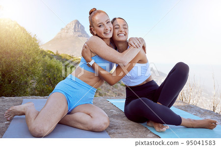 Exercise, friends and hug during yoga workout by woman bonding and meditating in nature together. Zen, health and relax by portrait of girl embrace during outdoor yoga class, excited about meditation 95041583