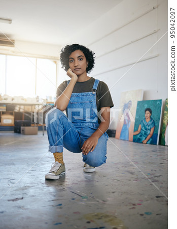 Artist portrait in studio, workshop with gallery of canvas artwork and young confident Indian woman. Professional creative graphic painter, cool art exhibition and designer oil painting lifestyle 95042097