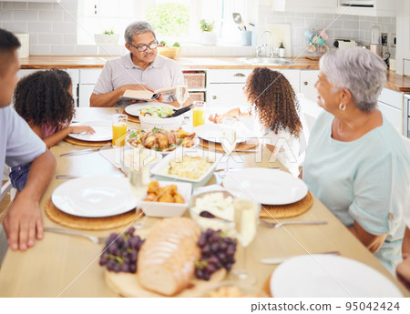 Mexico family, reading bible at Christmas lunch table with grandparents and children listening for faith, spiritual holiday and love. Happy indigenous people with religion prayer book on thanksgiving 95042424