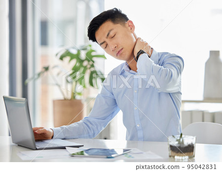 Stress, burnout and neck pain Asian man with headache, anxiety and depression working with laptop on report, tax or audit in office. Frustrated and tired business man with mental health overworked 95042831