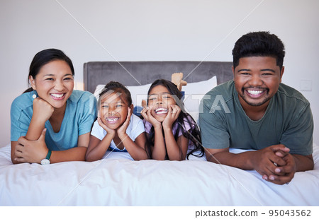 Love, bed and portrait of relax happy family in hotel bedroom bonding, smile and enjoy quality time together. Happiness, peace and Malaysia family of mom, dad and children on travel holiday vacation 95043562