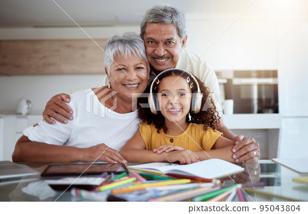 Portrait, girl and grandparents in homework, education and learning for childhood development at home. Happy child in homeschool smile with grandma and grandpa together in support to study and learn Portrait, girl and grandparents in homework, education and learning for childhood development at home. Happy child in homeschool smile with grandma and grandpa together in support to study and learn 95043804