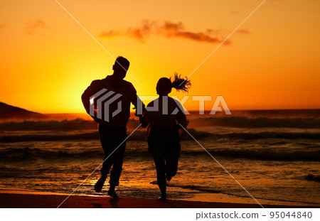 Fitness, beach and couple silhouette running at sunset, training in water and health workout. Love, sunrise and woman and man bond while exercise along the sea, healthy lifestyle with morning cardio Fitness, beach and couple silhouette running at sunset, training in water and health workout. Love, sunrise and woman and man bond while exercise along the sea, healthy lifestyle with morning cardio 95044840