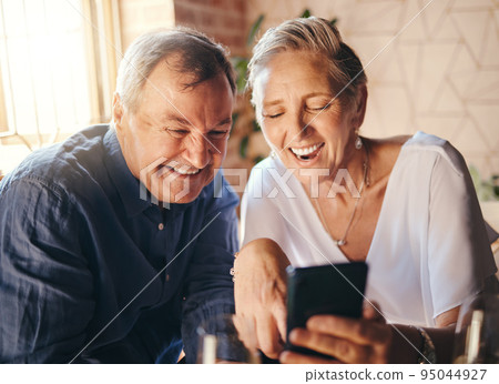 Happy, love and senior couple on a phone scrolling on social media together in coffee shop. Happiness, smile and elderly man and woman reading a blog on website or browsing the internet on smartphone Happy, love and senior couple on a phone scrolling on social media together in coffee shop. Happiness, smile and elderly man and woman reading a blog on website or browsing the internet on smartphone 95044927