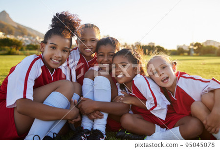 Team, soccer or happy sports girl with smile on field, grass or stadium for health, teamwork or wellness portrait. Children, football or exercise with support, diversity or motivation for sports game Team, soccer or happy sports girl with smile on field, grass or stadium for health, teamwork or wellness portrait. Children, football or exercise with support, diversity or motivation for sports game 95045078